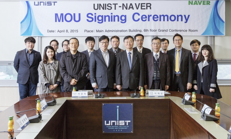 Attendees from the signing ceremony of MOU between UNIST and NAVER Corp. are posing for a group photo at UNIST.
