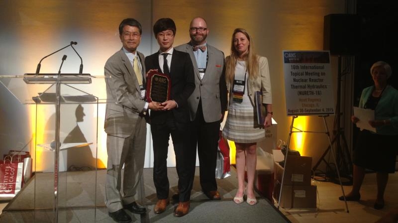 Prof. In-cheol Bang (left) and Researcher Kyung Mo Kim (2nd from the left) are holding a trophy after receiving the Best Paper Award at the 16th NURETH conference. l Photo Credit: Researcher Kyung Mo Kim