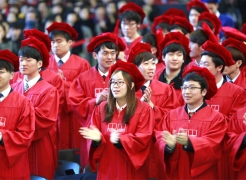 Graduates at the 2015 Commencement Ceremony, wearing academic regalia.