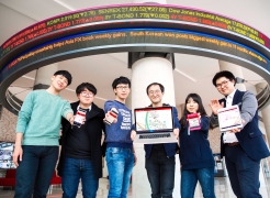 The SIMAPLE Startup team is posing for a group photo in front of LED Stock Ticker Board at Business Administration Bldg., UNIST. From left are Sung Joe Kim, YeongSeok Kim, SeungHoon Lee, KyungHoon Kim, SunHwa Lee, and Han Lee.