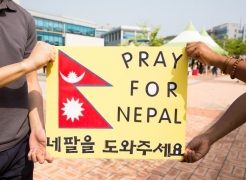 Members of the UNIST International Student Organization (UISO), holding a sign that said 