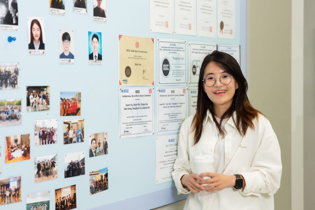 Hei In Yoon, posing for a portrait in front of her lab at UNIST.