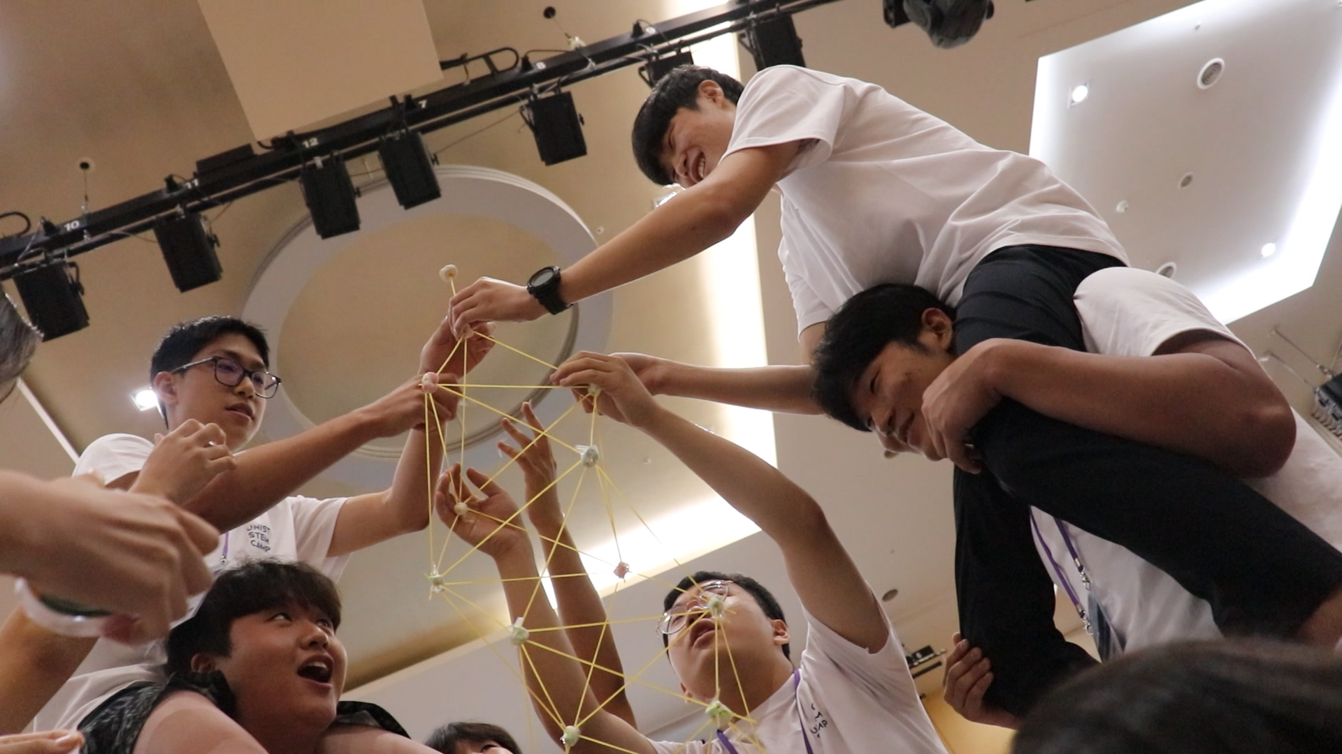 As an additional activity, student participants at the UNIST STEM Camp enthusiastically engage in a tower building game.