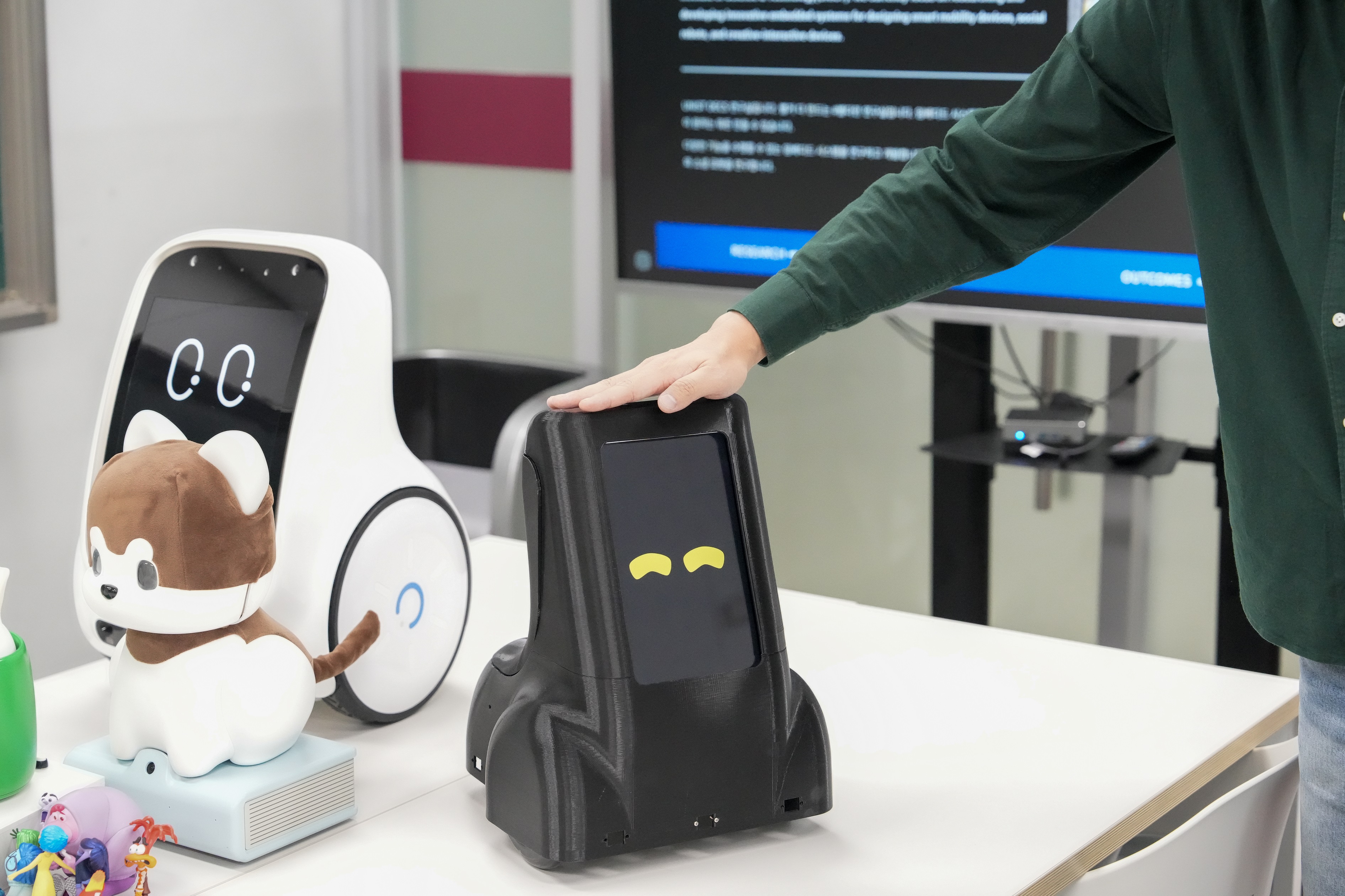 Shown above is a scene where the robot expresses happiness when gently touched.