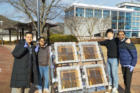 Dr.-Hansora-far-right-celebrates-a-research-milestone-with-colleagues-in-front-of-a-solar-hydrogen-panel-at-UNIST..png