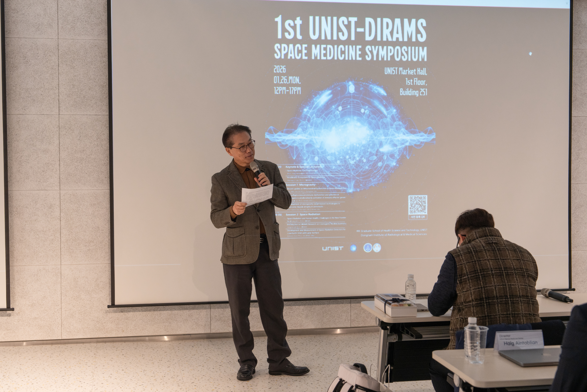 UNIST President Chong Rae Park is delivering a welcome remark at the symposium on January 26, 2026.